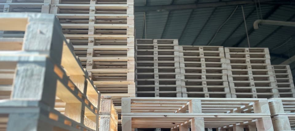 Finished wooden pallets stacked to the rafters inside the Al Ikhlas Wood plant in Qalyoub.